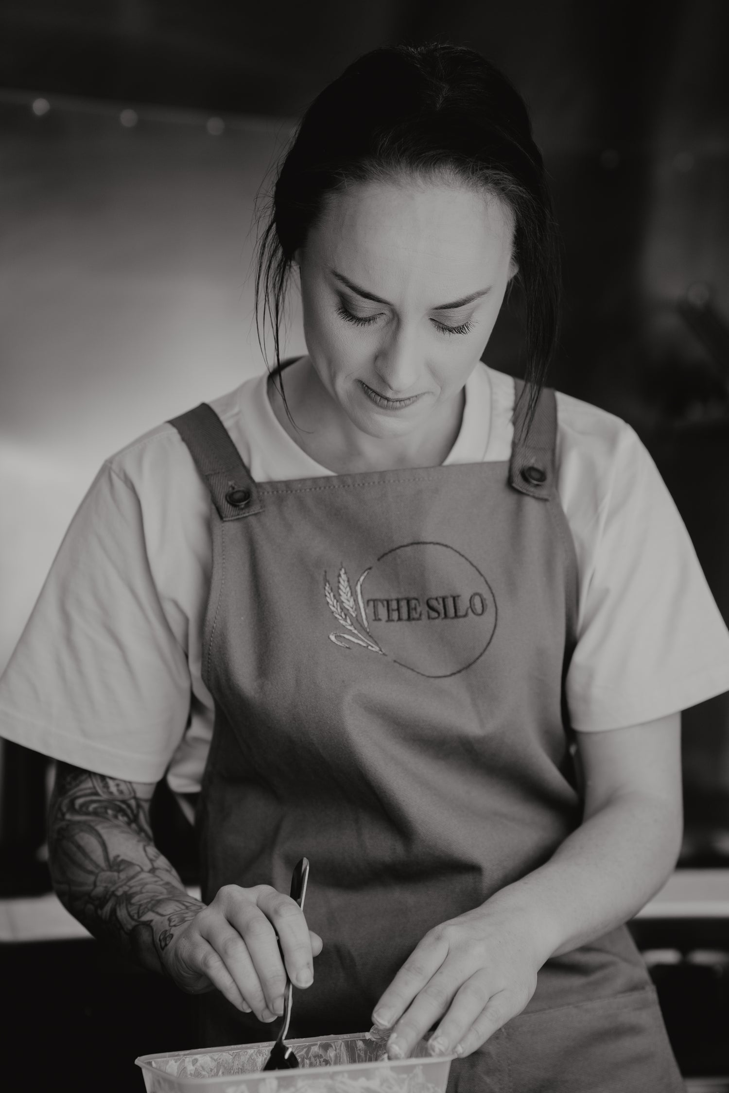 Charlotte cooking in The Silo