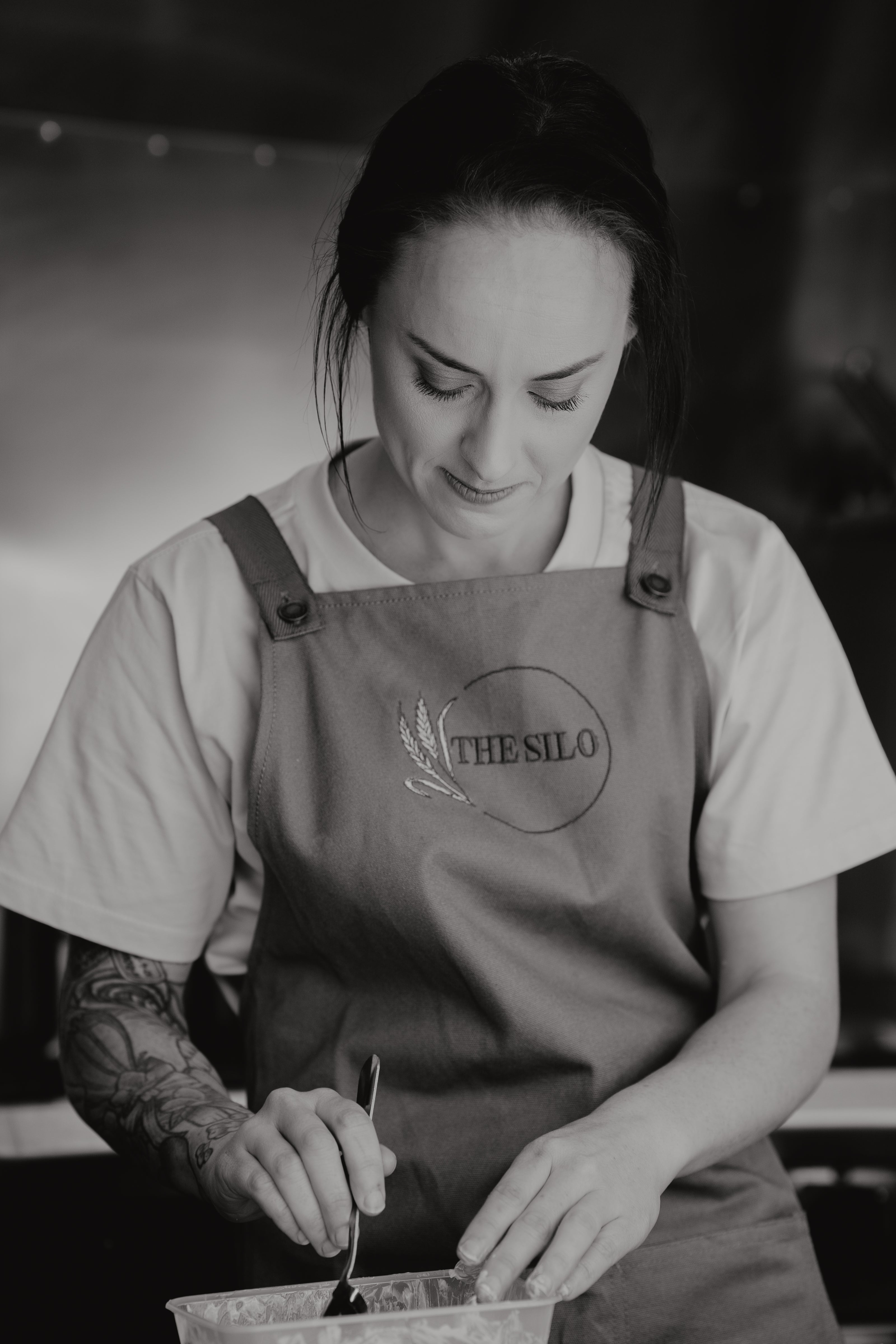 Charlotte cooking in The Silo